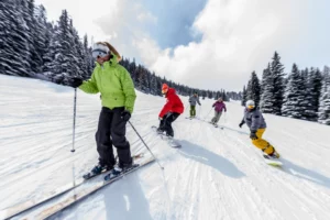 Skiers and boarders together on a ski trail