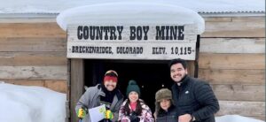 Family standing in front of the Country Boy Mine in Breckenridge