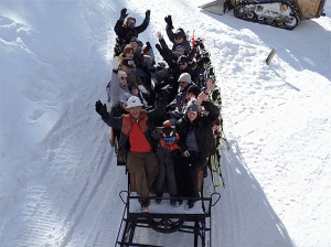 Monster Truck towing a sled full of people